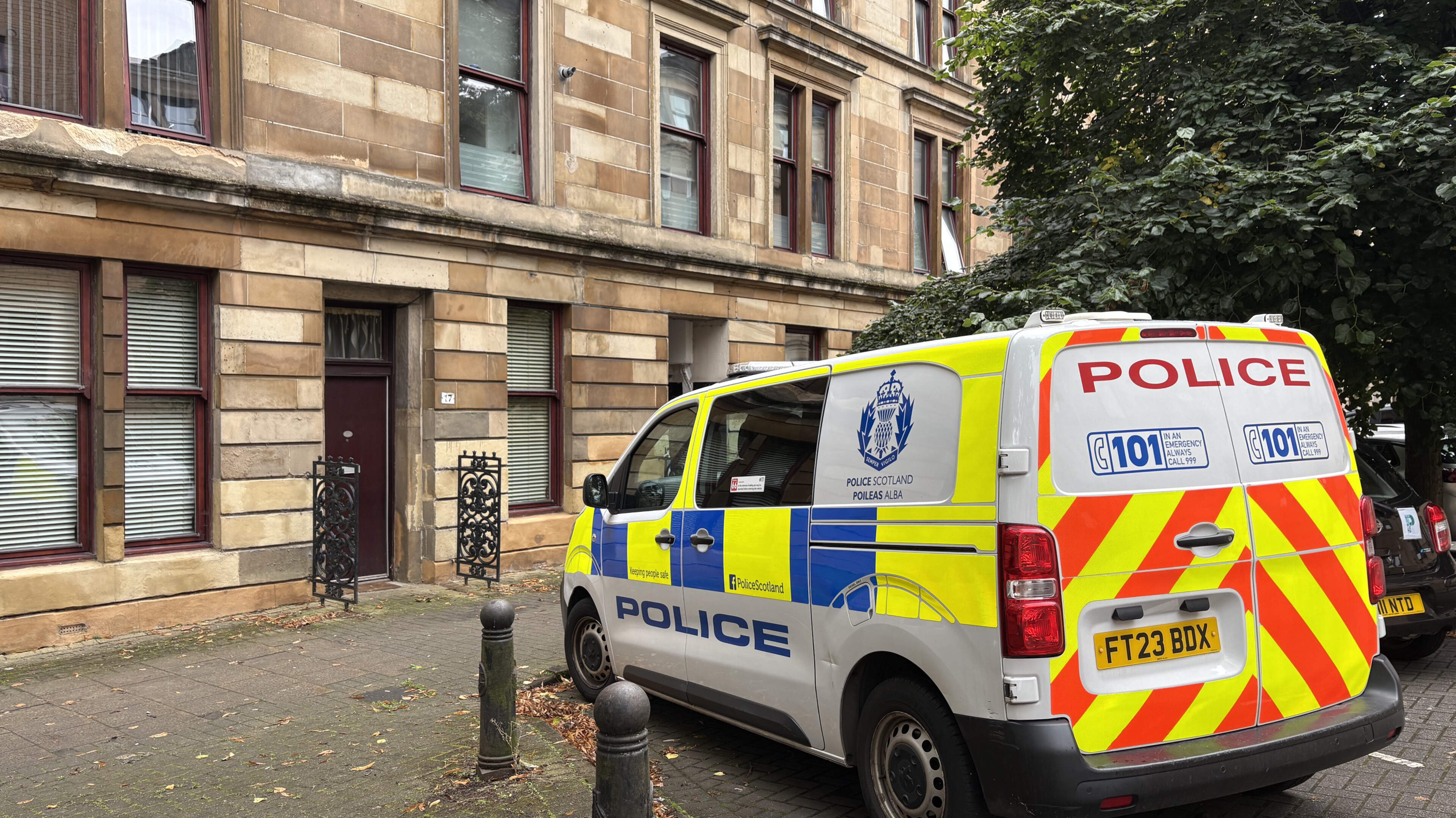 Double murder hunt launched after two men found dead in Glasgow flat